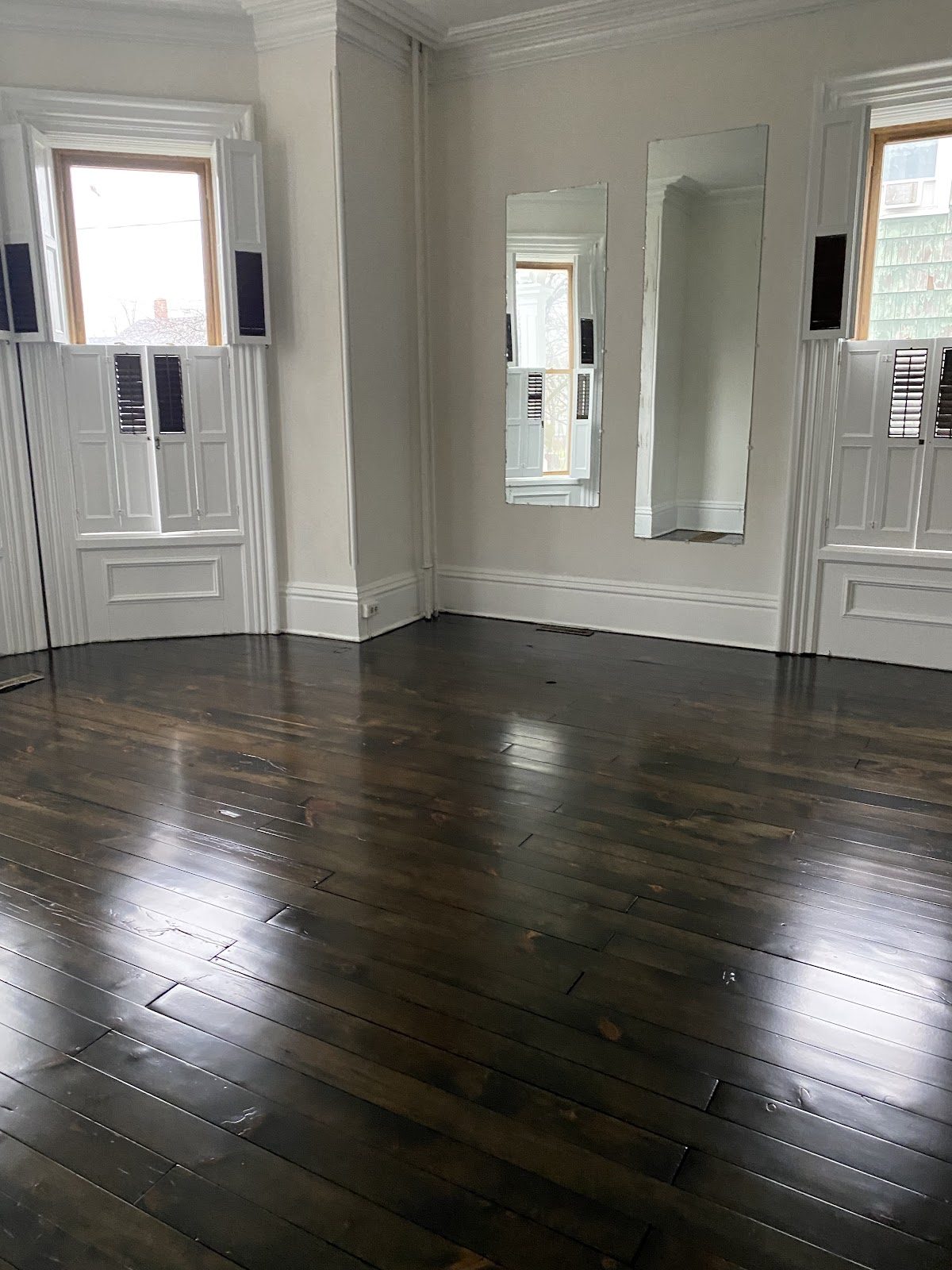 Dark-stained wide plank floor